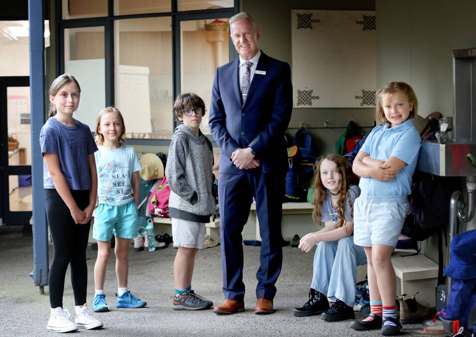 The COVID generation. Principal Geoff Fouracre with students from grades 3 and 5. Left to right: Emily, Marlon Clode, Davie Stinzaini, Flora MacDougall and Bridie Cooper. Picture: James Croucher