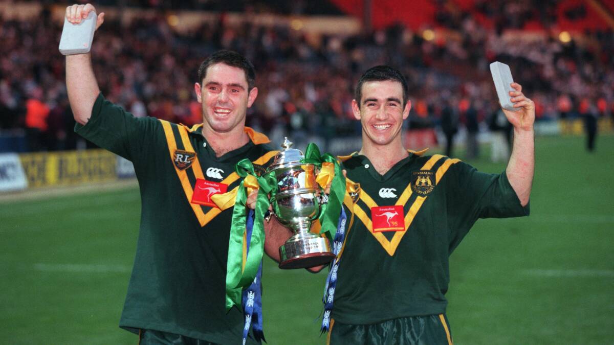Captain Brad Fittler and Andrew Johns (right) of Australia hold the trophy after the Kangaroos won the 1995 Rugby League World Cup. Photo: Mark Leech/Getty Images