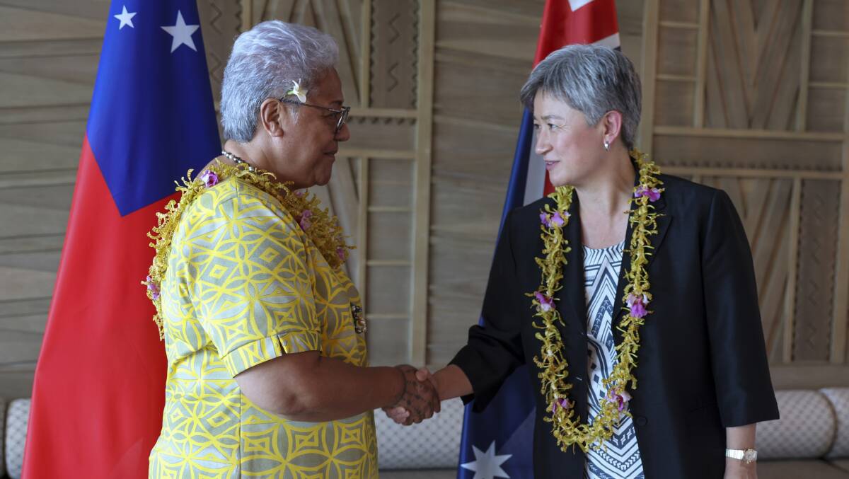 Australian Foreign Minister Penny Wong, right, shakes hands with Samoa's Prime Minister Fiame Naomi Mataafa on Thursday. Picture: Department of Foreign Affairs