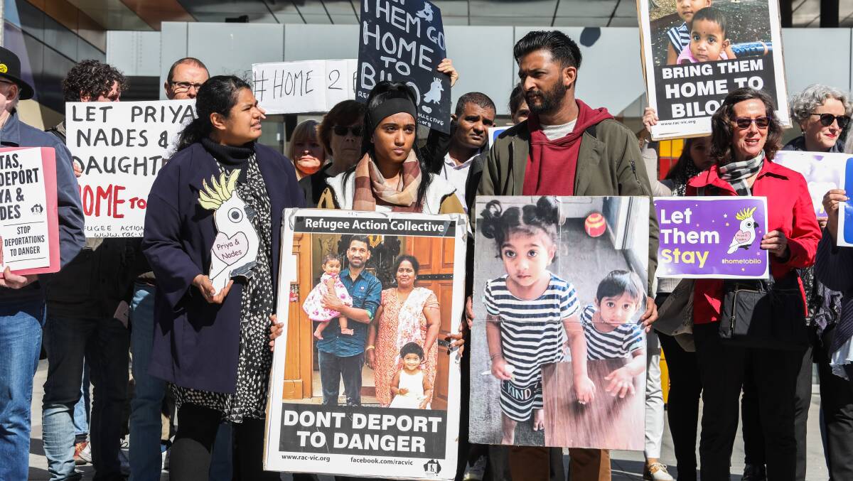 Protesters outside the Federal Court in Melbourne in 2019 hold placards in support of the Biloela Tamil family currently living on Christmas Island. Picture: Getty Images