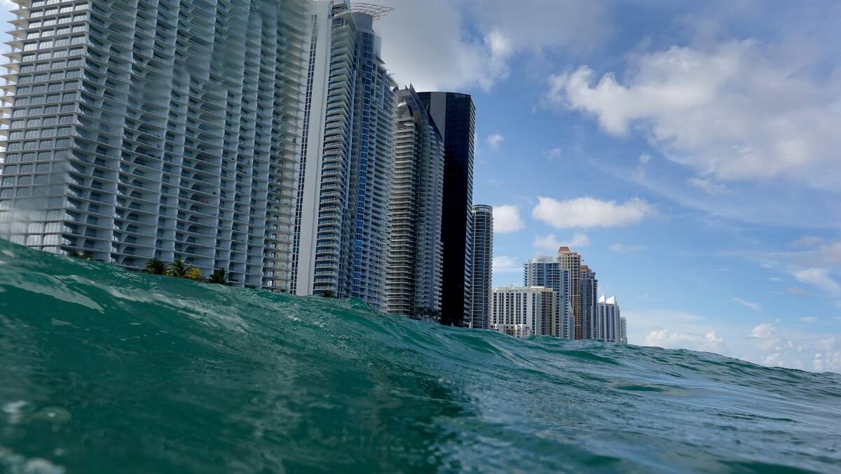 Waves lap ashore near condo buildings in Sunny Isles, Florida, on the day of the IPCC report's release. Picture: Getty Images