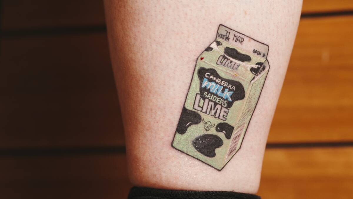 A Canberra nurse has had a Raiders-themed milk carton tattooed on her ankle to show her ongoing commitment to the team. Picture: Dion Georgopoulos