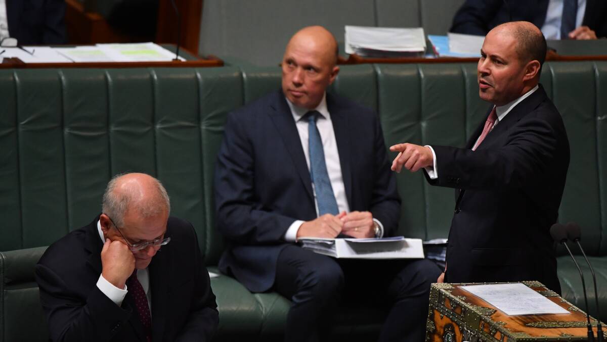 Treasurer Josh Frydenberg, right, and Defence Minister Peter Dutton, centre, are considered the most likely successors to the party leadership. Picture: Getty Images