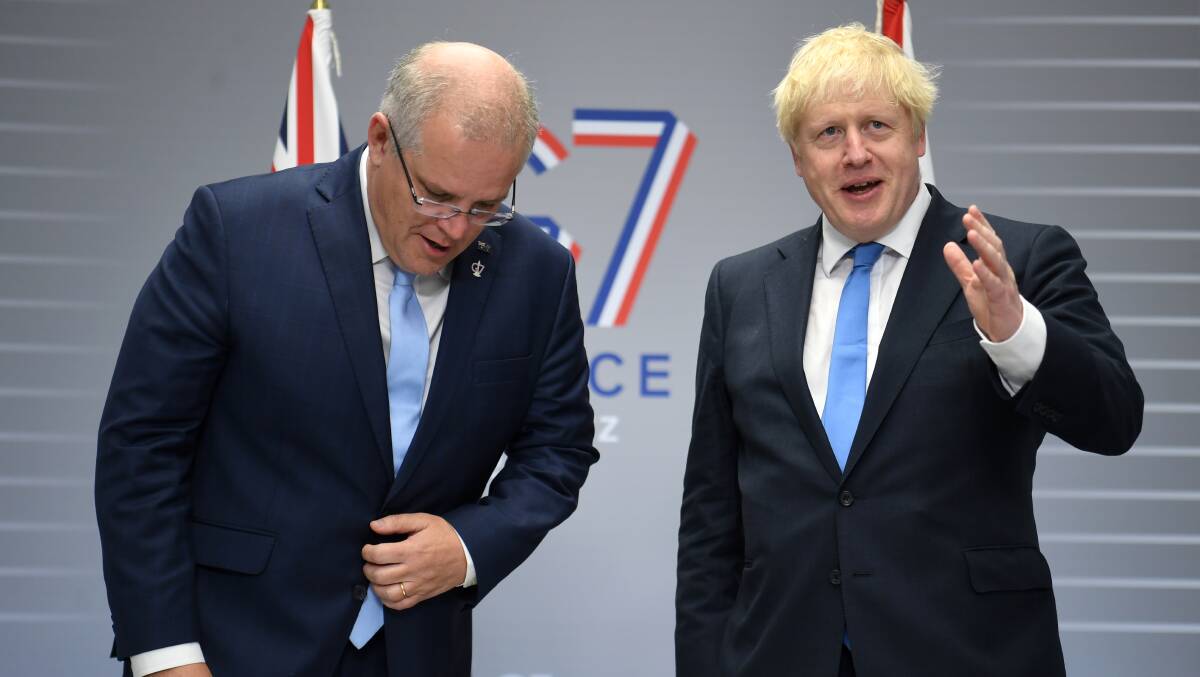 Australian Prime Minister Scott Morrison and his UK counterpart Boris Johnson are ideological bedfellows but have very different ambitions on climate. Picture: Getty Images