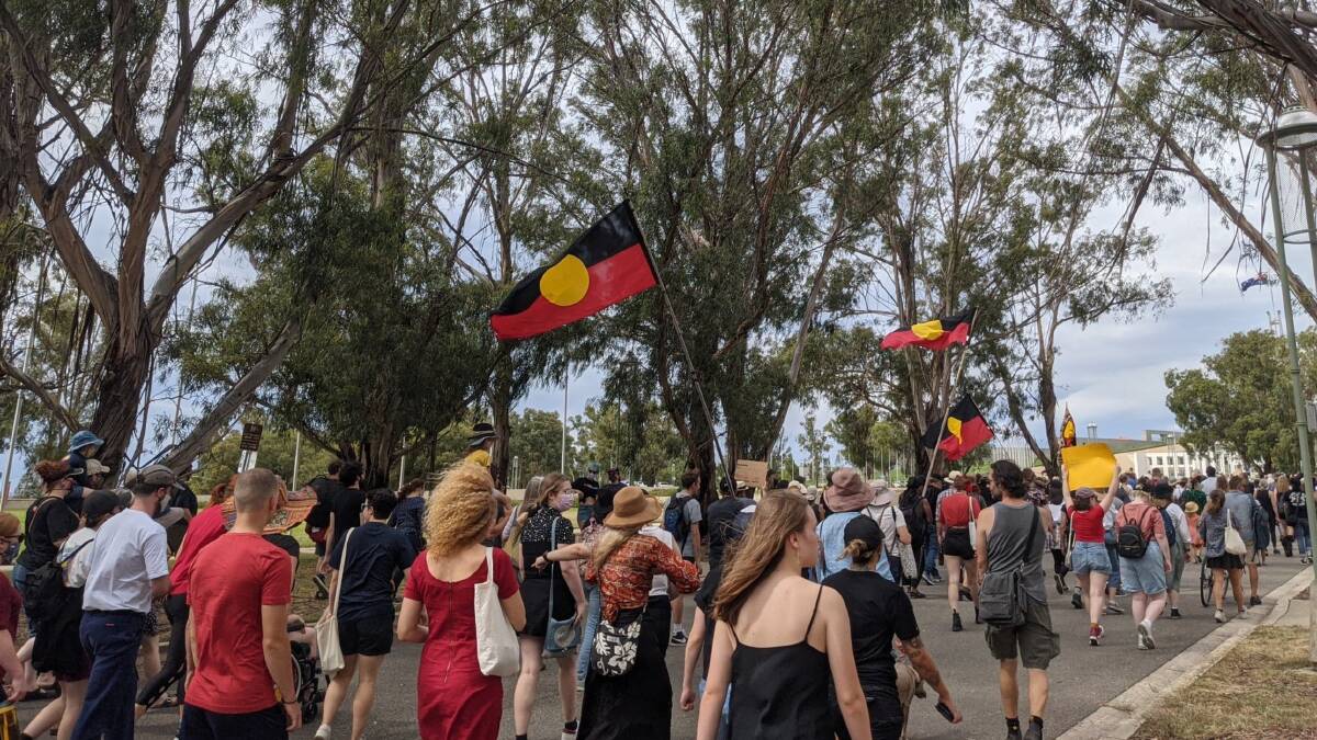 Protesters marching toward Parliament House in Canberra on Tuesday morning. Picture: Sarah Basford Canales