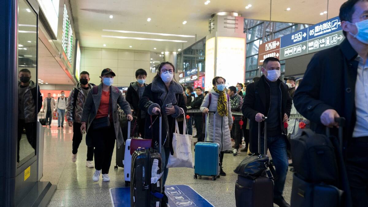 Travellers wearing masks at Chengdu's airport to prevent infection from the coronavirus. Picture: Shutterstock