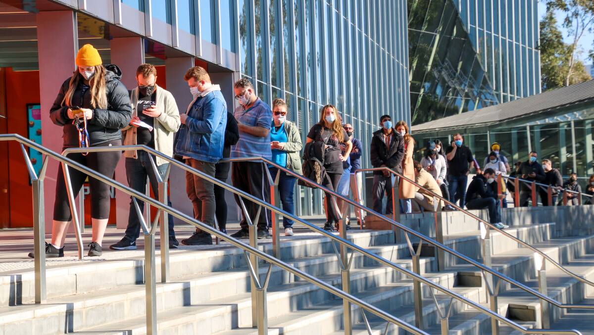 Melbourne residents queue for a COVID-19 vaccine in June. Picture: Shutterstock