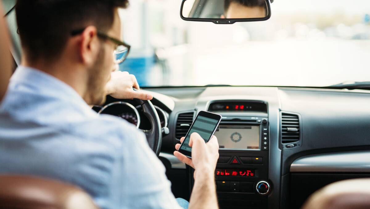 At 60km/h, looking at your phone for just three seconds means you are driving blind for 50 metres. Picture: Shutterstock