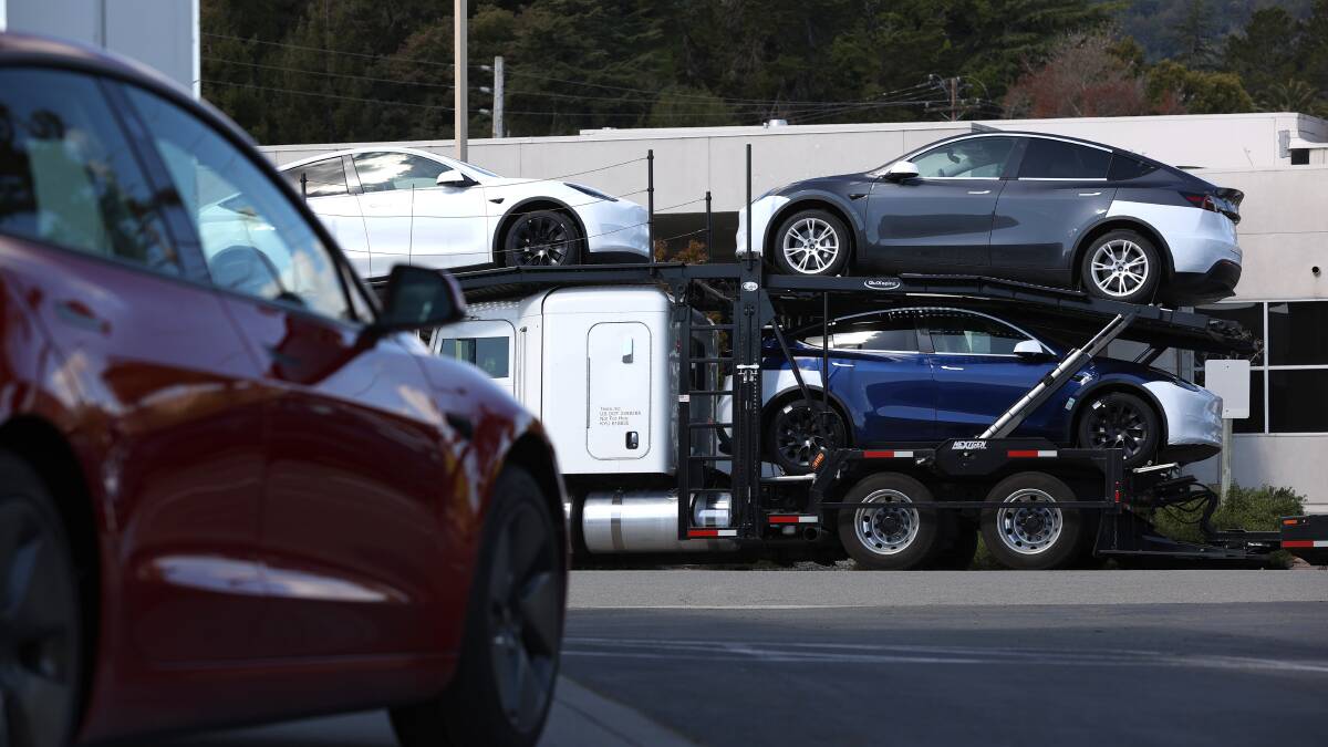 Brand-new Tesla cars outside a Tesla dealership in California in April. Pictures: Getty Images