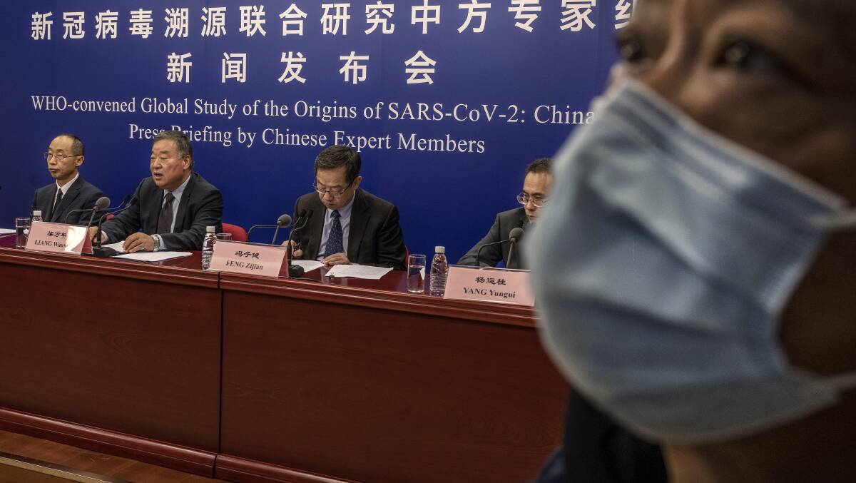 Expert Group on Covid Response head Liang Wannian, second from left, answers a question at a press conference addressing the World Health Organizatino's report on the origins of SARS-CoV-2. Picture: Getty Images