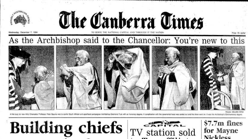 Photographer Colleen Petch captured Archbishop Desmond Tutu briefly entangled after being presented with an honorary doctorate by ANU chancellor Peter Baume in 1994. Picture: The Canberra Times