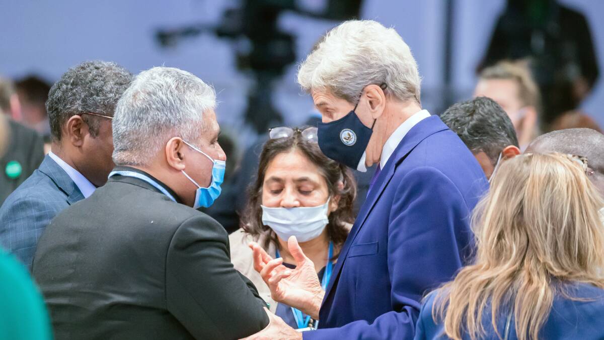 US climate envoy John Kerry (right) speaks to Indian Environment Minister Bhupender Yadav at the Glasgow COP26 climate summit. Picture: Getty Images