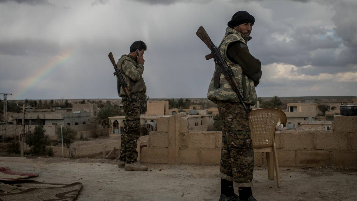 Fighters from the Syrian Democratic Forces, a US-backed Kurdish-led alliance, in Bagouz, Syria. Picture: Getty Images