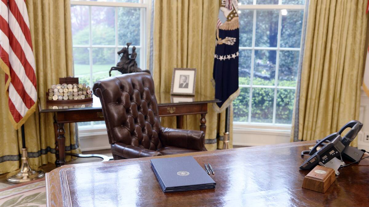 Outgoing presidents traditionally leave a note for their successor in a drawer of the Resolute desk. Picture: Getty Images
