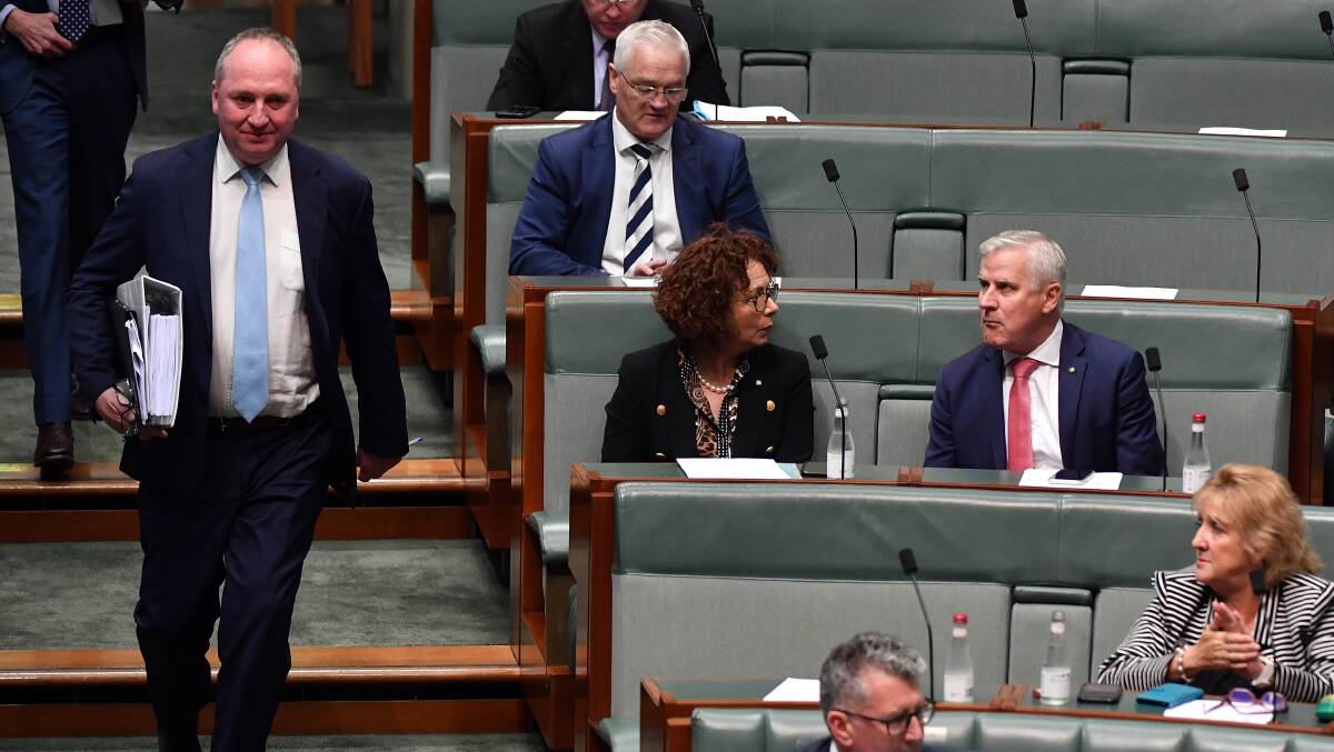 Deputy Prime Minister Barnaby Joyce (left) arrives at the house for question time on Wednesday. Picture: Getty Images