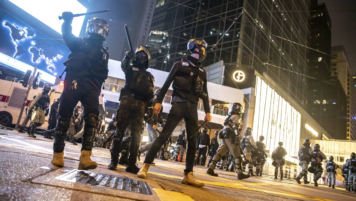 Police disperse crowds in Hong Kong's central district during a protest in January. Picture: Sitthixay Ditthavong