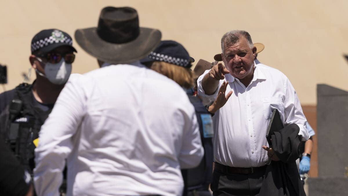 MP Craig Kelly prepares to sign protesters in to Parliament House on Tuesday. Picture: Getty Images