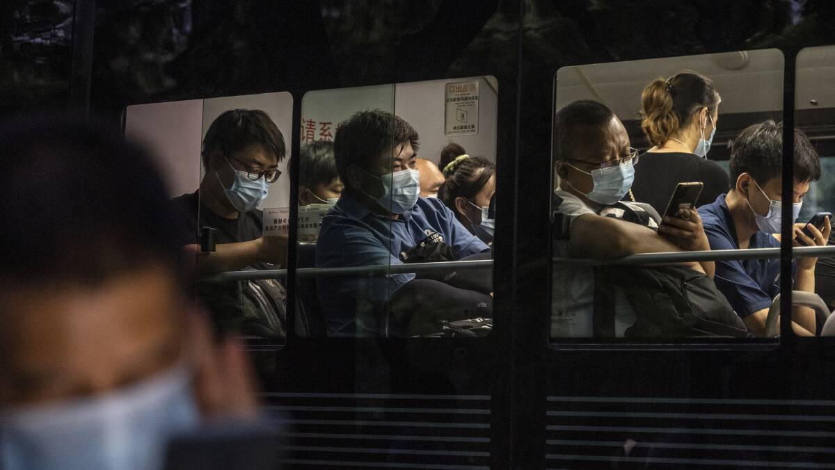 Commuters wear masks to protect against COVID-19 during rush hour in Beijing on August 4. Picture: Getty Images