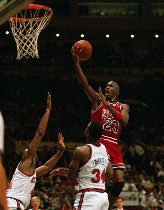 Michael Jordan soars through the air for the Chicago Bulls during a game against the New York Knicks in 1989. Picture: Getty Images