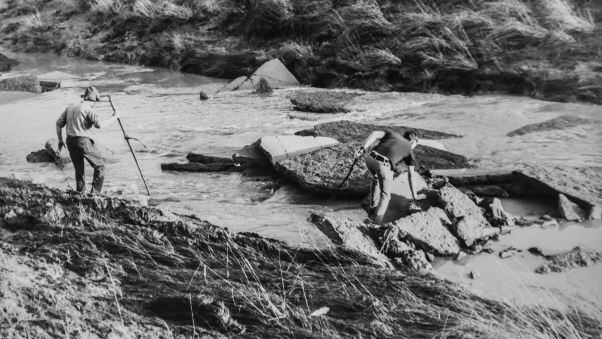Police searched stormwater drains and Yarralumla Creek for the bodies of people caught in the floods. Picture: Canberra Times archives