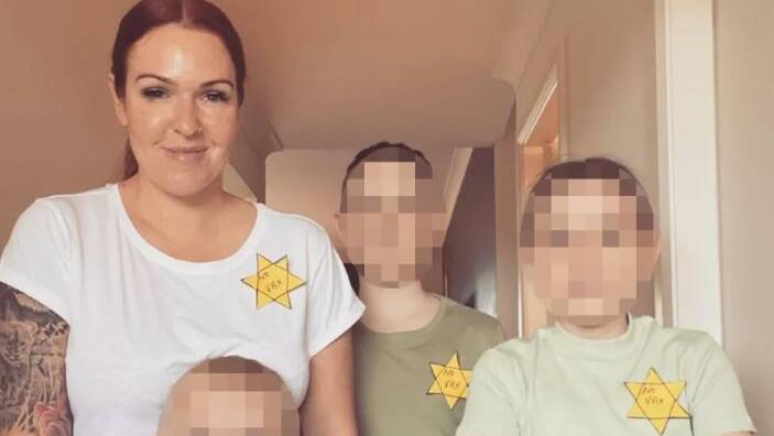 An anti-vaxxer NSW mother last month posted this image of herself and her family wearing the yellow Star of David. Picture: Facebook
