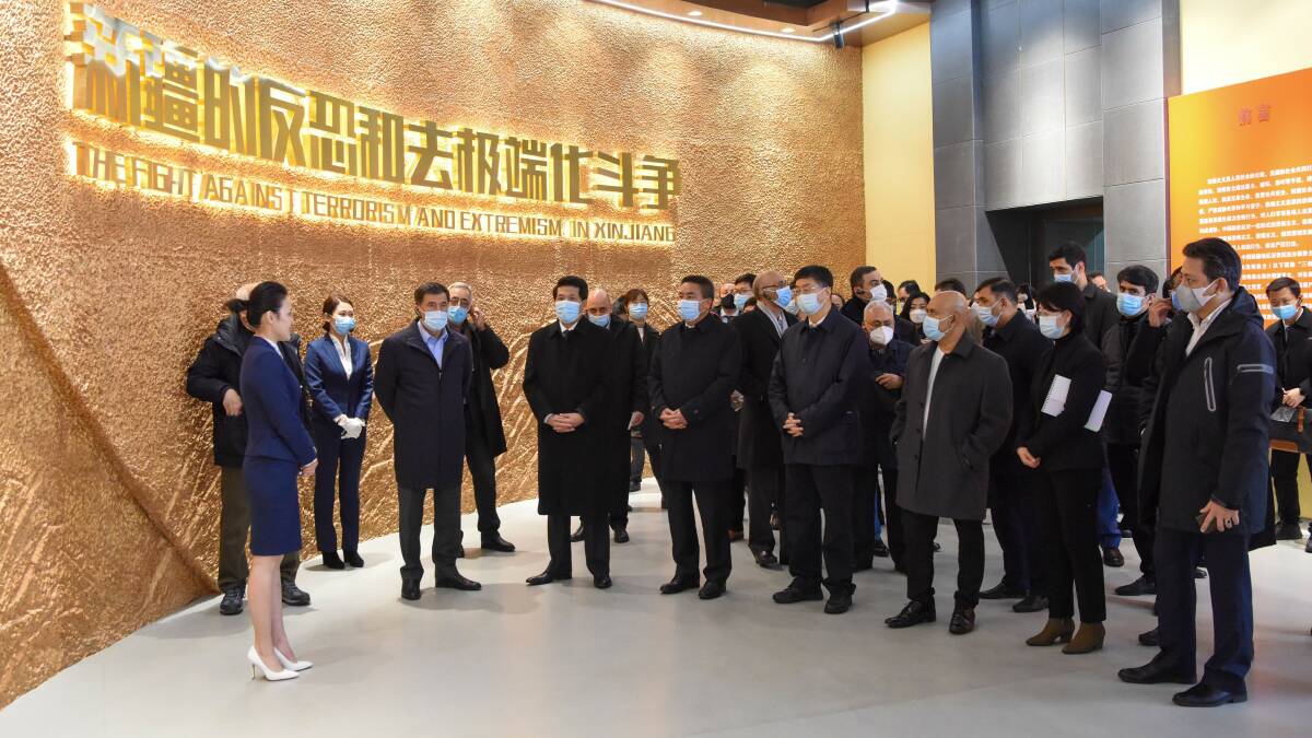 Foreign diplomats visit an exhibition themed around the "fight against terrorism and extremism" in Urumqi, capital of the Xinjiang Uighur Autonomous Region. Picture: Getty Images