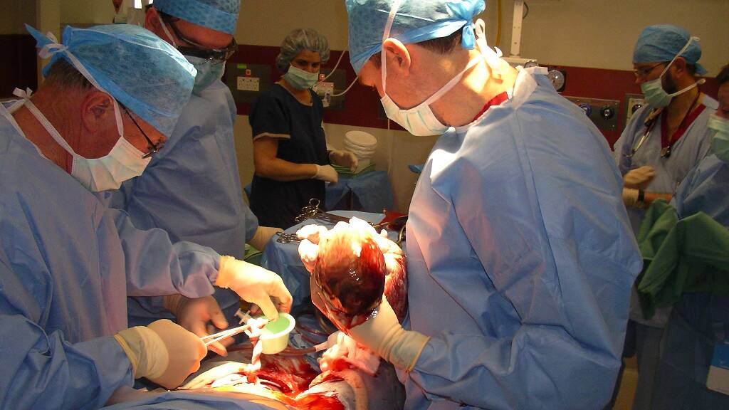 Dr Peter Scott delivering Beth Rickwood's son, Jack, by caesarean section in 2004. Picture: Supplied