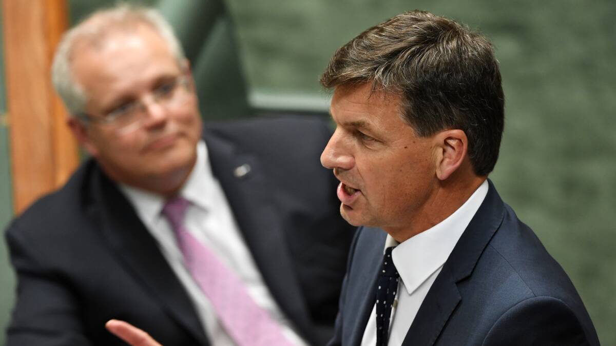 Scott Morrison watches on as embattled minister Angus Taylor addresses Parliament. Picture: Getty Images
