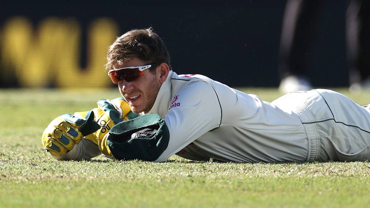 Tim Paine reacts after dropping a catch during day five of the third Test at the SCG. Picture: Getty Images
