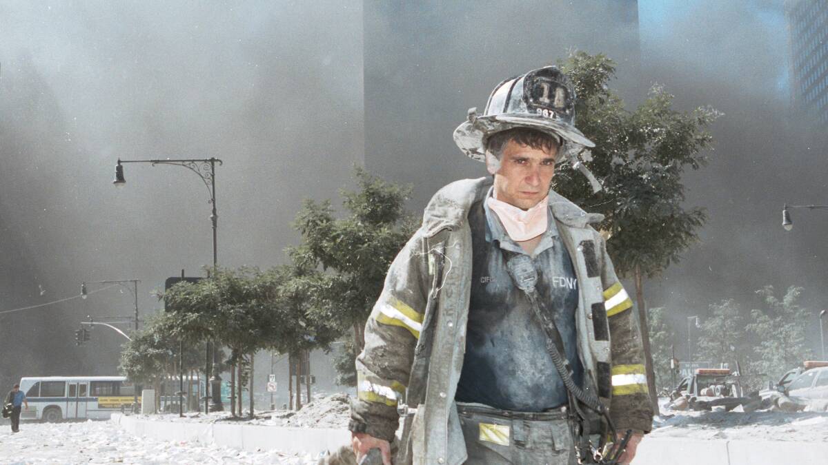 An unidentified New York City firefighter near Ground Zero on September 11, 2001. Picture: Getty Images