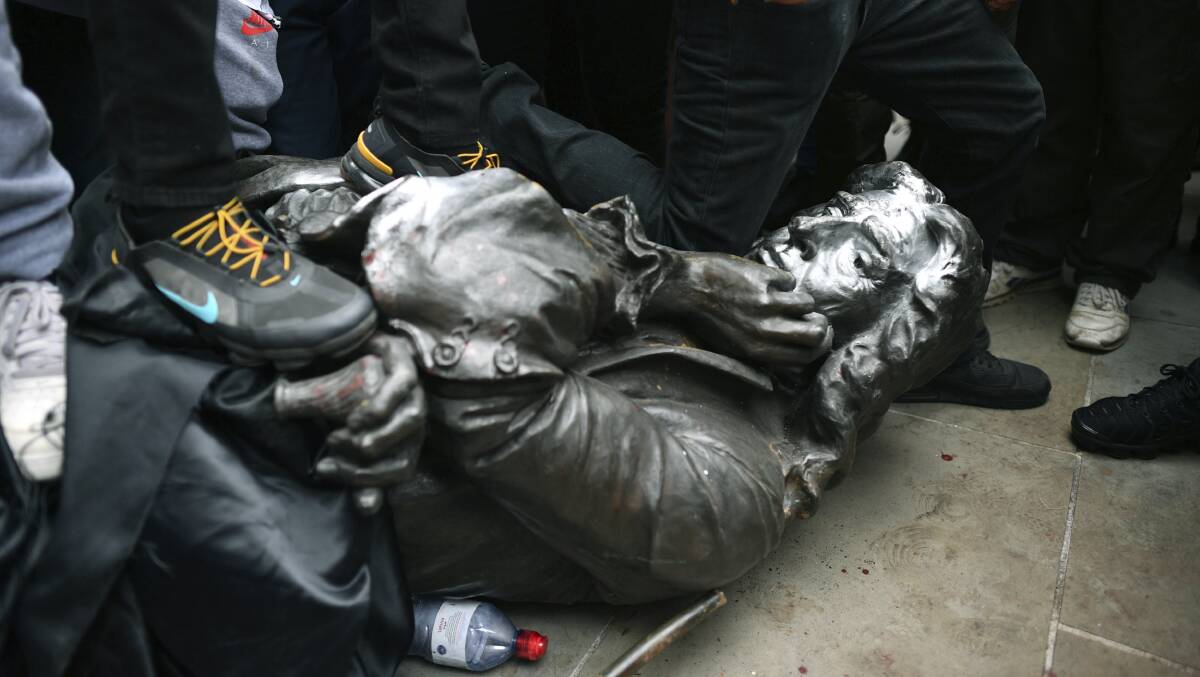UK protesters pulled down a statue of slave trader Edward Colston during a Black Lives Matter rally before dumping it in a harbour. Picture: Ben Birchall/PA