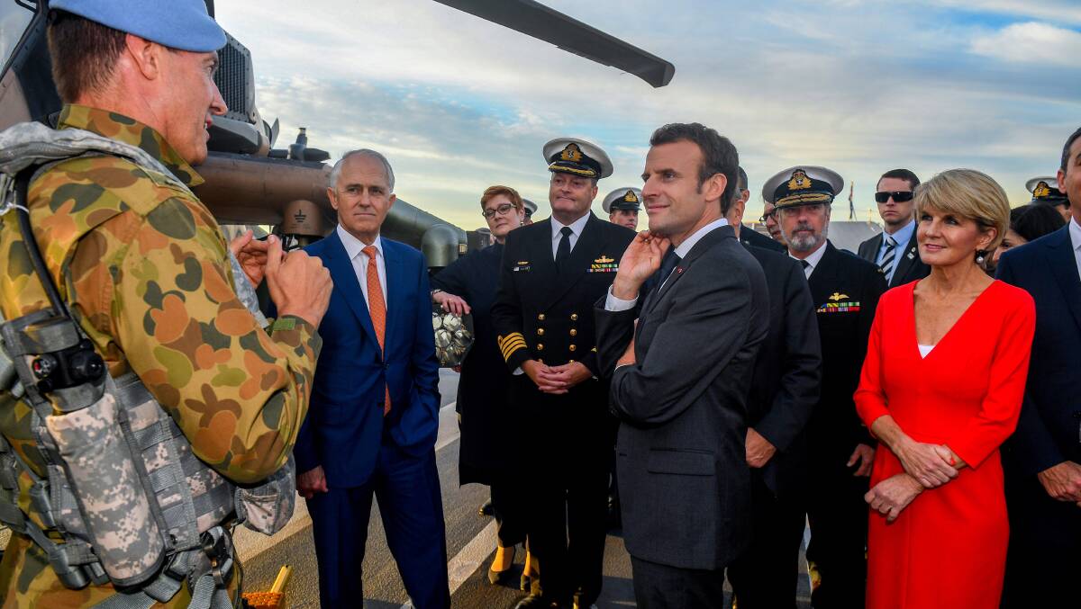 Former Australian prime minister Malcolm Turnbull (second from left) and former foreign minister Julie Bishop (right) discuss defence arrangements with French President Emmanual Macron and military personnel in Sydney in 2018. Picture: Getty Images