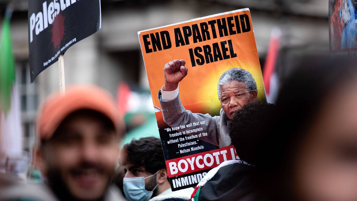 A placard with a portrait of Nelson Mandela seen during a march to the Israeli embassy in London in 2021. Picture: Getty Images