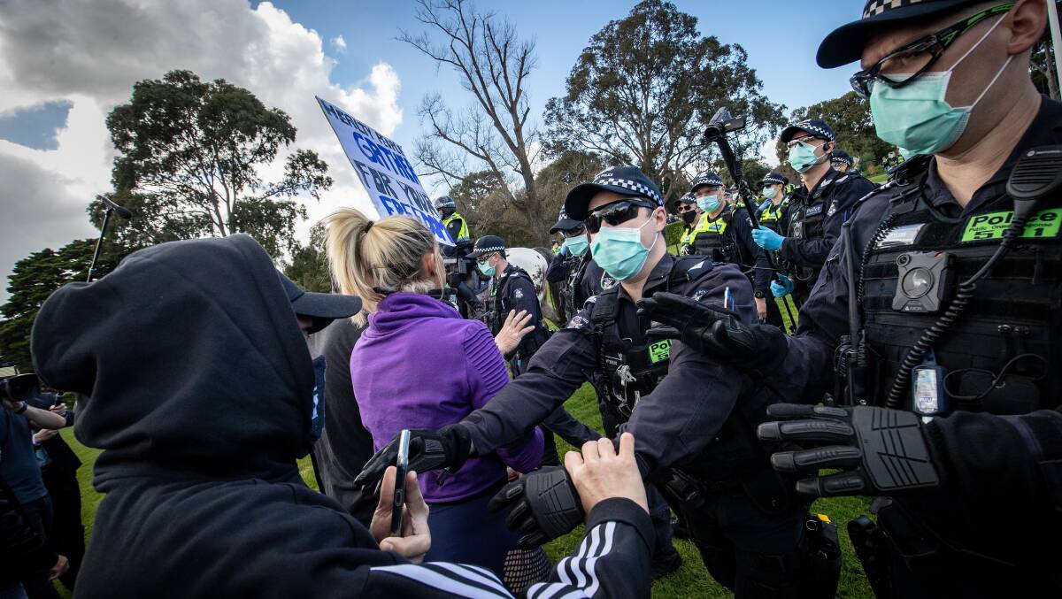Anti lockdown protesters clash with police officers at the Shrine of Remembrance. Picture: Getty Images