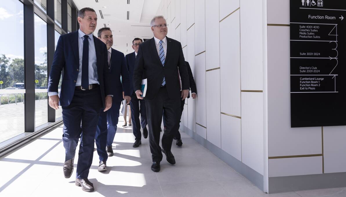 Scott Morrison is flanked by state and territory leaders as they arrive for a press conference on Monday. Picture: Getty Images
