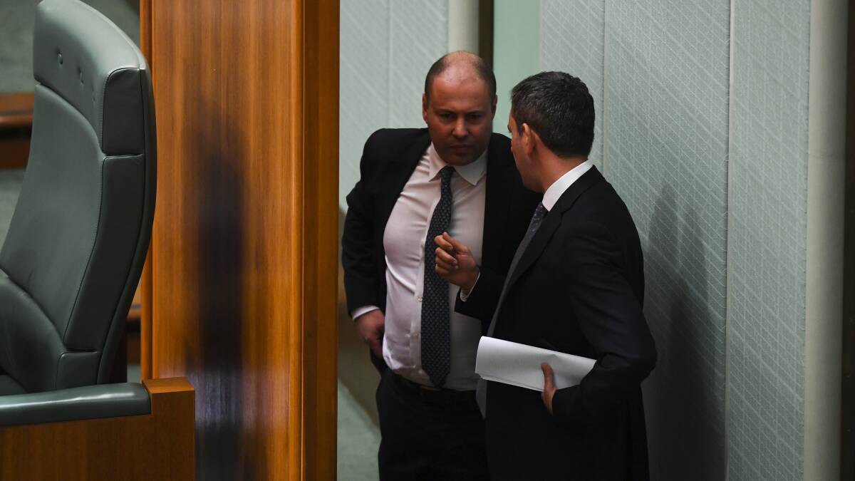 Treasurer Josh Frydenberg (left) and shadow treasurer Jim Chalmers chat behind the Speaker's chair in 2019. Picture: AAP