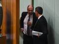 Treasurer Josh Frydenberg (left) and shadow treasurer Jim Chalmers chat behind the Speaker's chair in 2019. Picture: AAP