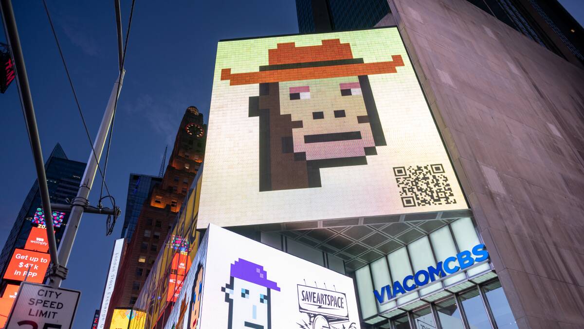 A CryptoPunk digital art non-fungible token (NFT) is displayed on a digital billboard in Times Square, New York City on May 12, 2021. Picture: Getty Images