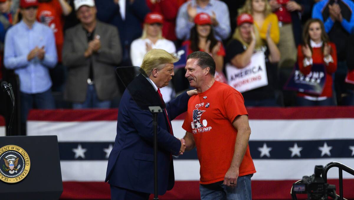 US President Donald Trump shakes hands with Minneapolis Police Union head Bob Kroll during a campaign rally in October 2019. Picture: Getty Images