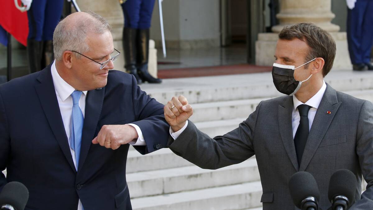 Macron was much too polite to punch Morrison in the mouth. But one got the sense he would have liked to if the opportunity had presented itself. Picture: Getty Images