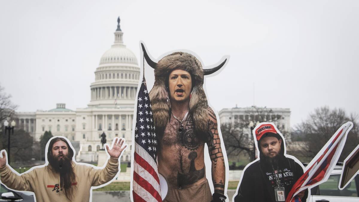 Cardboard cutouts of Facebook chief executive Mark Zuckerberg dressed as the "QAnon Shaman" and other January 6 rioters were placed outside Congress by activists attempting to highlight the role played by social media organisations in the Capitol insurrection. Picture: Getty Images