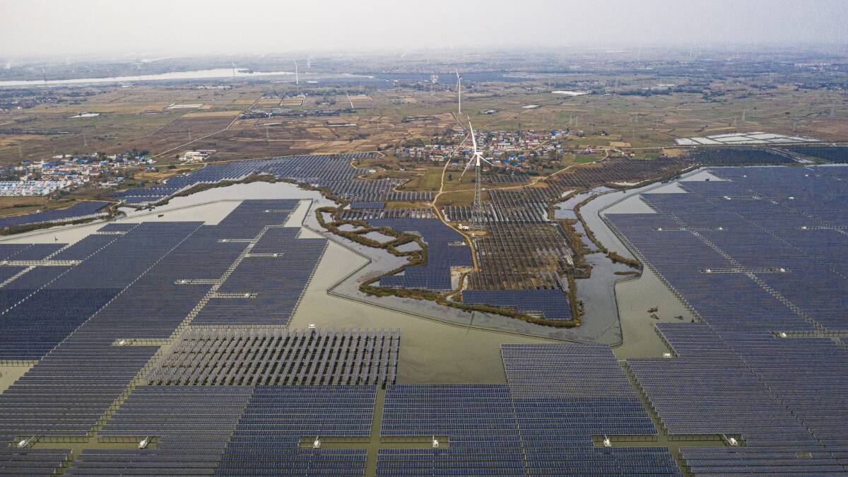 An aerial photo taken on Monday shows neatly lined photovoltaic facilities in the shallow waters of Tiangang Lake in Suqian city, Jiangsu Province, China. Picture: Getty Images