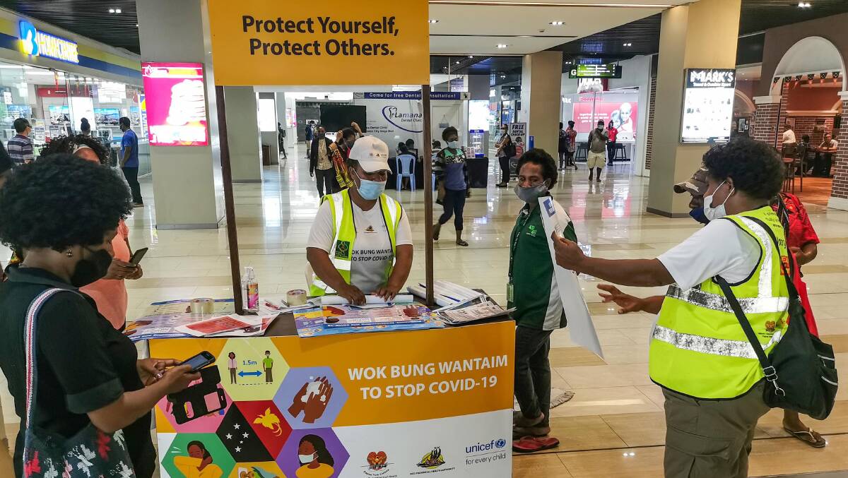 A COVID-19 information stall at a Port Moresby shopping centre. Picture: Getty Images