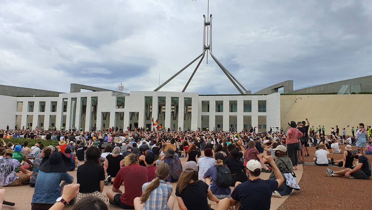 Hundreds, if not thousands gathered outside Parliament House on Tuesday morning for an Invasion Day rally. Picture: Andrew Thorpe