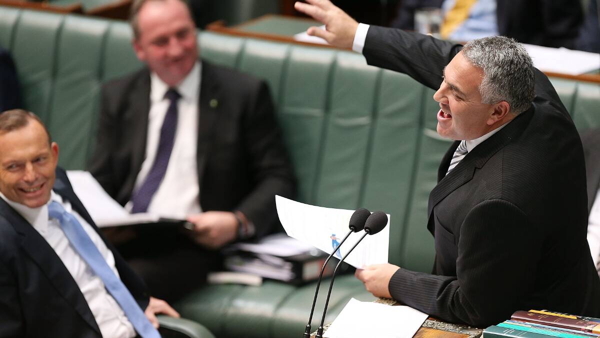 Former treasurer Joe Hockey (right) addresses Federal Parliament in 2015. Picture: Getty Images