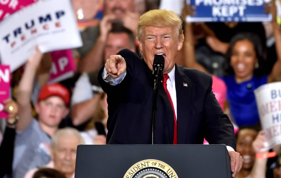 US President Donald Trump points to the media during a rally he held to mark 100 days in office. Picture: Shutterstock