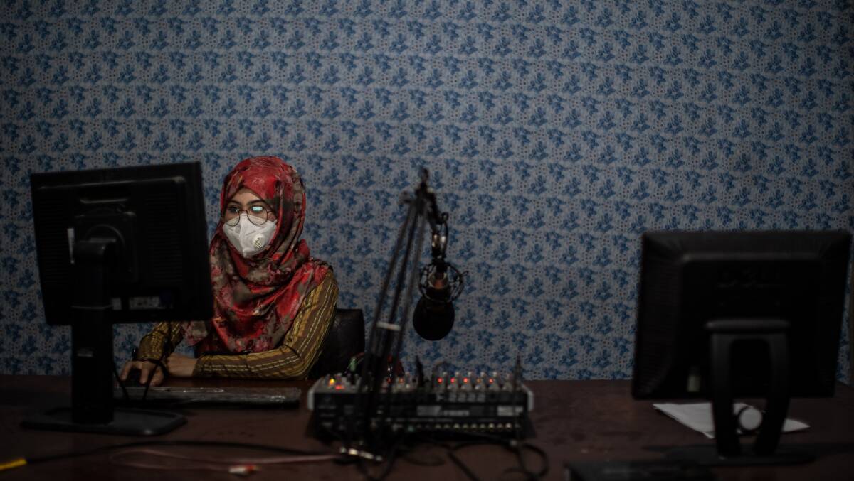 20-year-old Afghan radio journalist Nadia Safi in the studio of Radio Zohra, a female radio station in Kuduz, northern Afghanistan. The host was last on air on August 7, a day before the Taliban took over. Picture: Getty Images