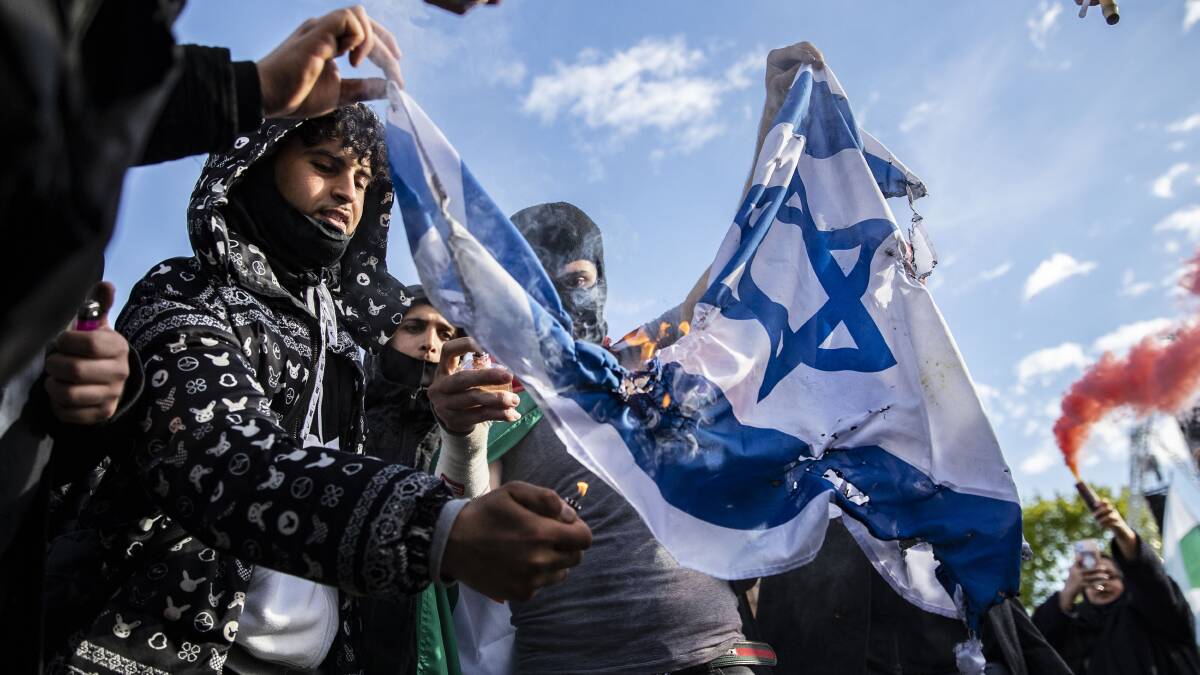 Palestinian supporters burn an Israeli flag in London's Hyde Park. Palestinian leaders have repeatedly rejected offers of full statehood incorporating Gaza, the vast majority of the West Bank and a capital in east Jerusalem. Picture: Getty Images