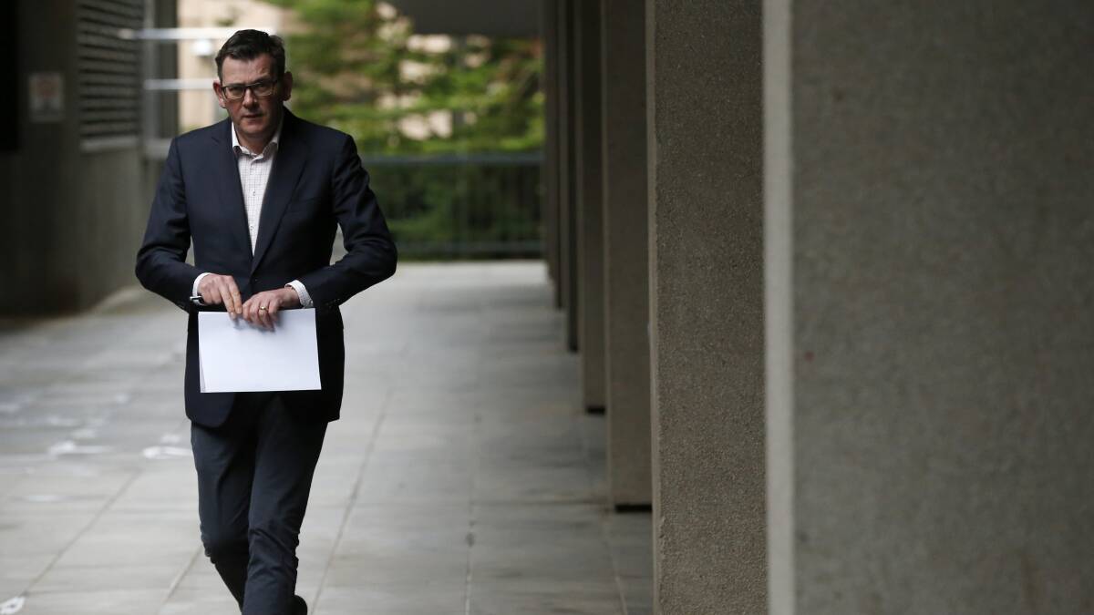 Victorian Premier Daniel Andrews walks to the daily briefing on Tuesday in Melbourne. Picture: Getty Images