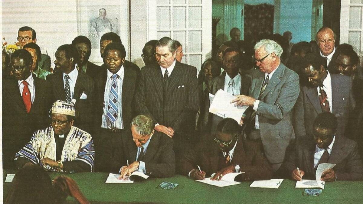Rhodesian leader Ian Smith (seated, second from left) and moderate African nationalist leaders sign the Rhodesian Internal Settlement in 1978. Picture: Ministry of Information, Immigration and Tourism, Government of Rhodesia/Public Domain